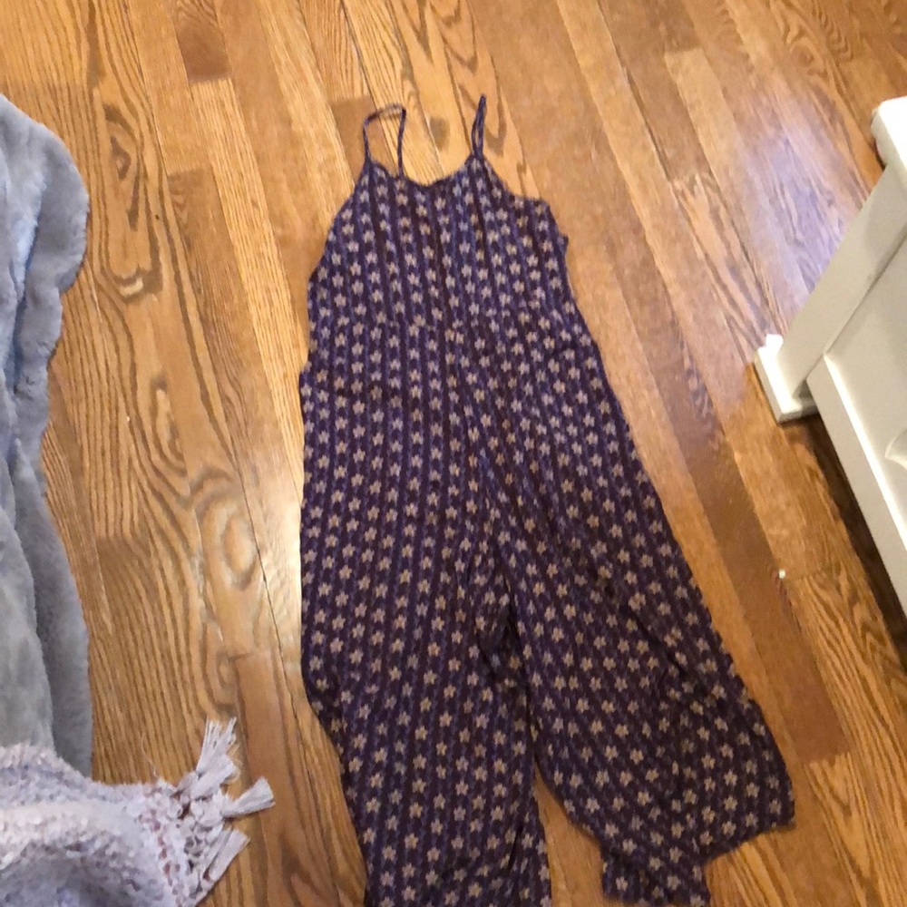 Brown jumpsuit with purple and yellow flowers